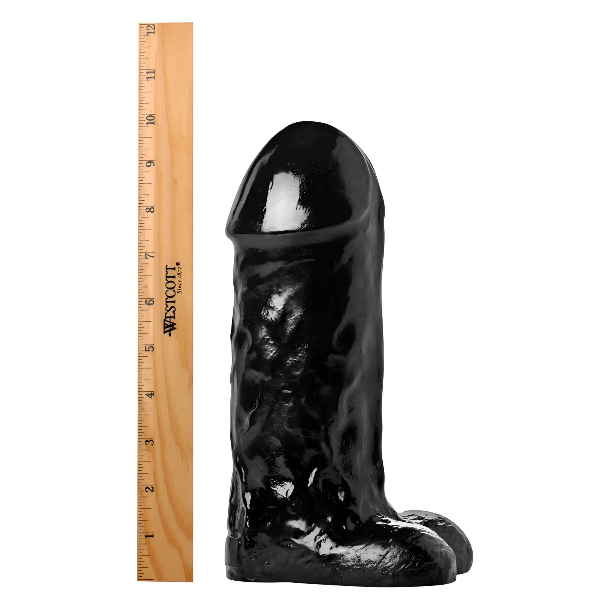 Master Cock The Cyclops Cock: A glossy black, textured phallic-shaped toy next to a 12-inch wooden ruler.