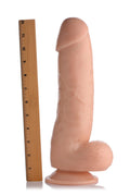 Master Cock The Forearm, a 13-inch realistic flesh-toned dildo with a suction base, shown next to a 12-inch ruler.