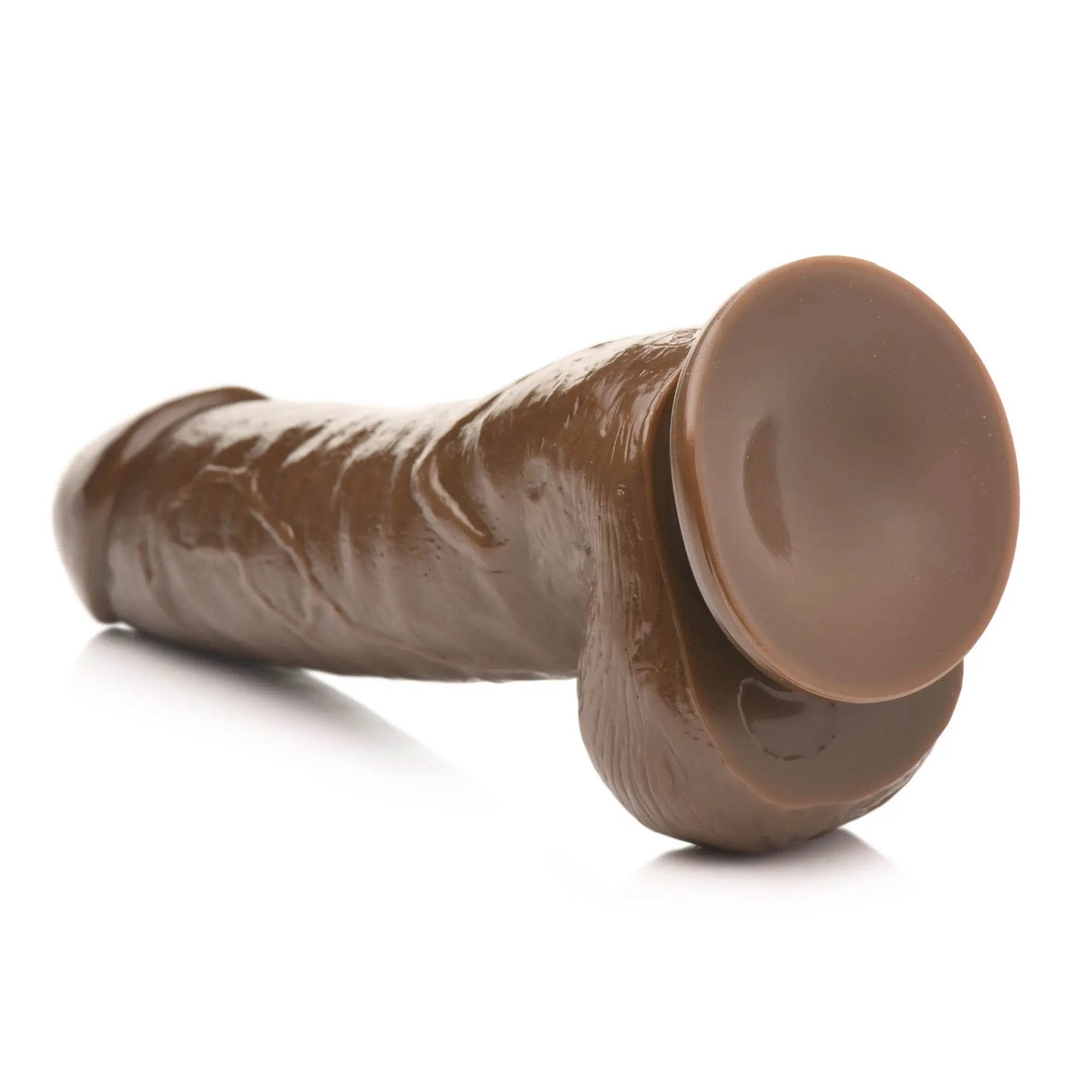 Master Cock Forearm dildo in dark brown, featuring a textured, realistic design and a sturdy base suction cup.