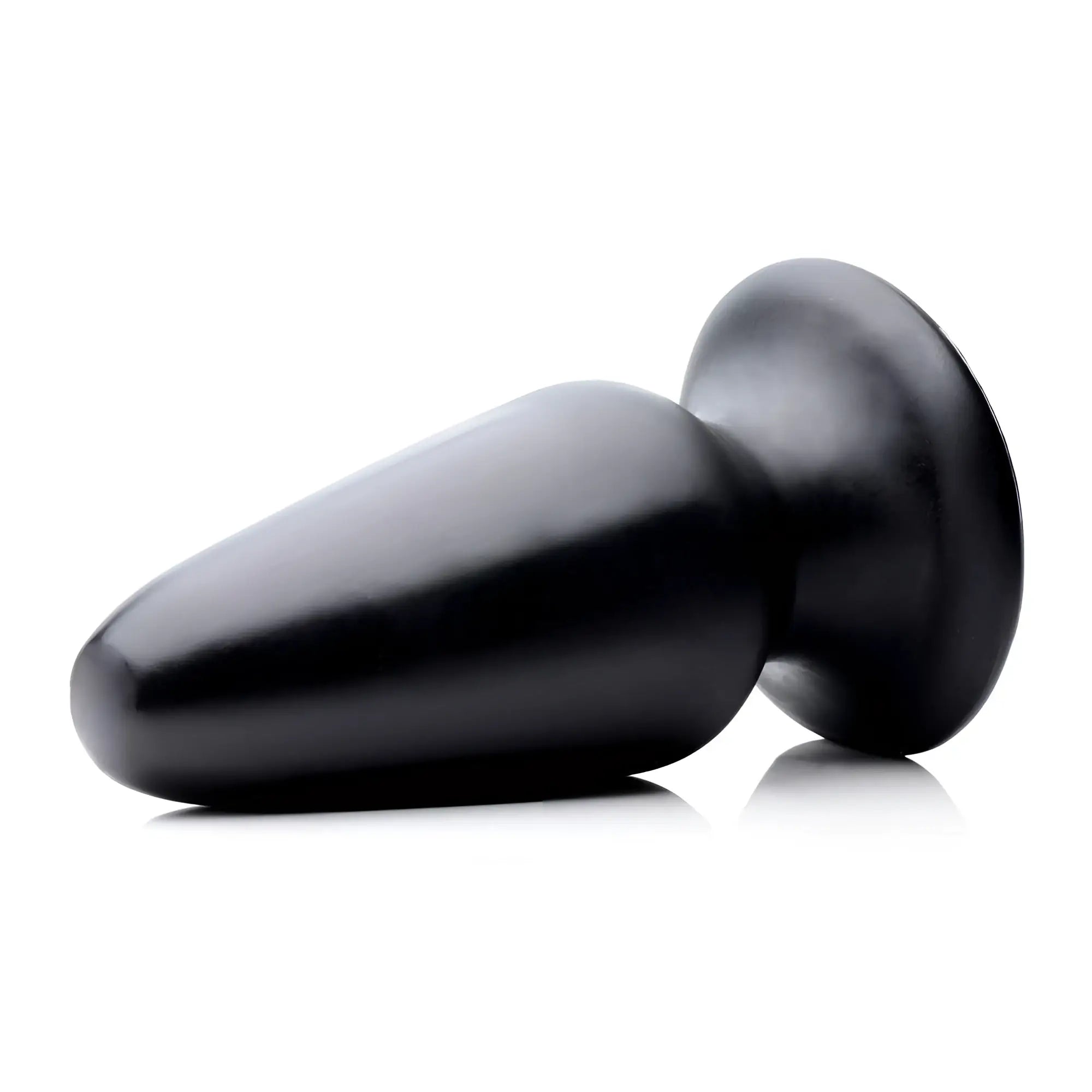Master Cock Gigantor XXXL black, smooth, tapered silicone butt plug with a wide, flat base, isolated on white.