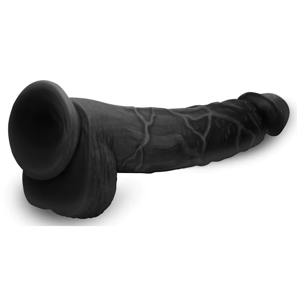 Master Cock Hung Harry 11.75-inch black, realistic-textured dildo with base and scrotal detail, isolated on white.