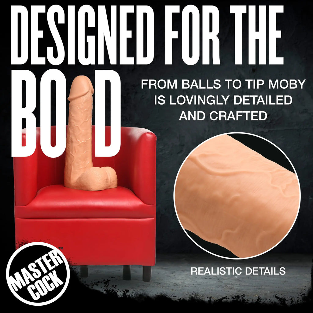 Master Cock Light Moby Huge dildo, 2 feet tall, realistic flesh-toned silicone, shown on a red chair.