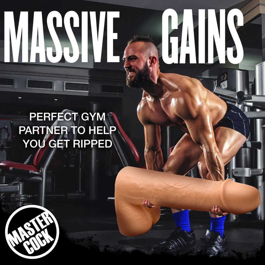 A muscular man lifts a large, skin-toned, 2-foot Master Cock Light Moby Huge dildo like a weight in a gym setting.