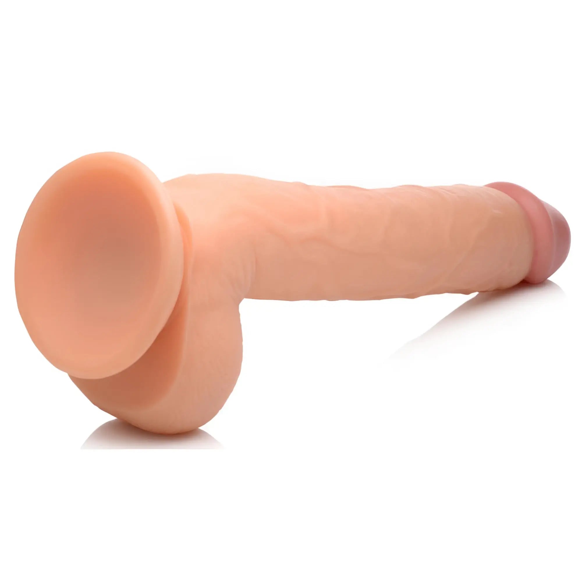 Master Cock Long Logan 10-inch flesh-colored dildo with realistic texture, scrotum base, and a suction cup stand.