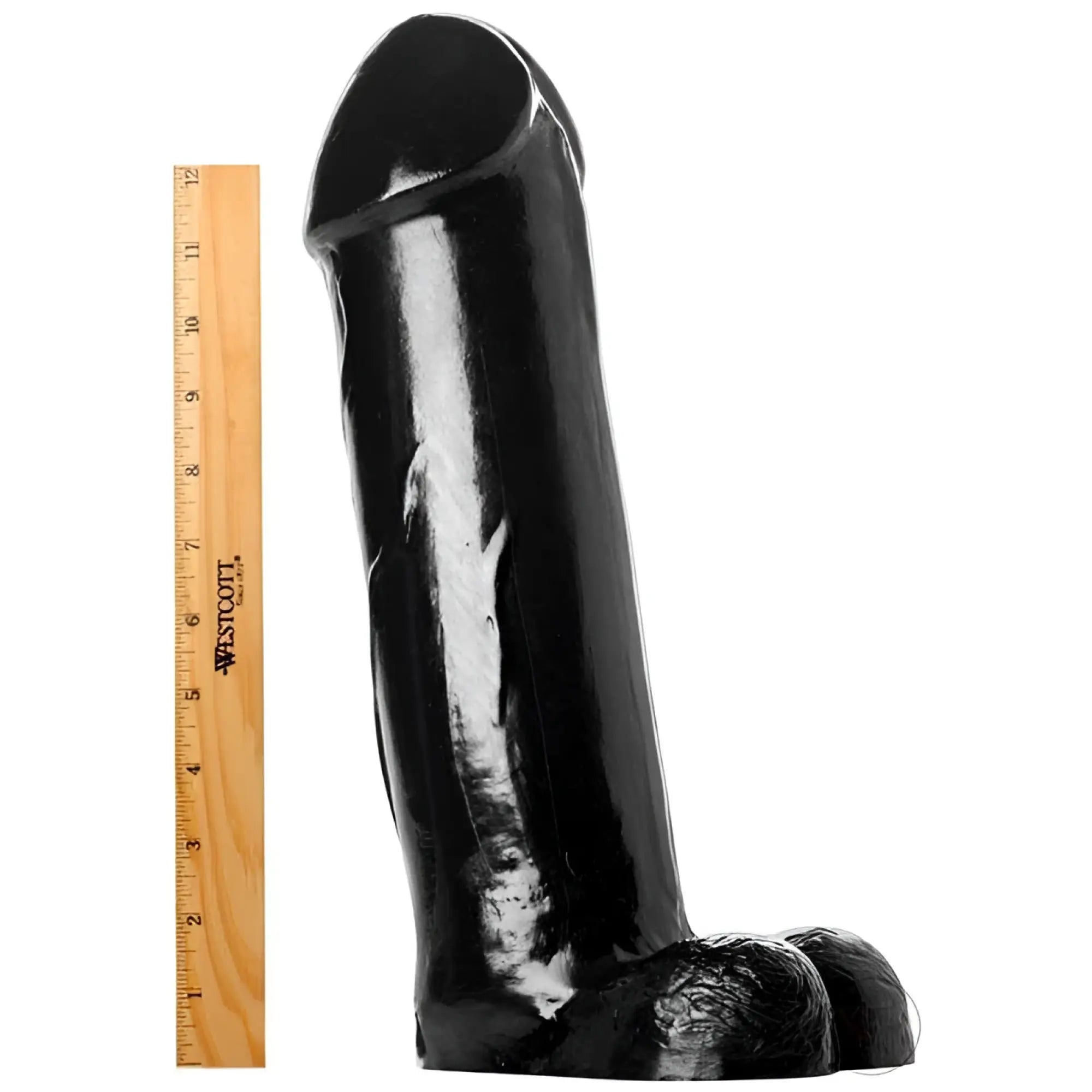 Master Cock The Titan: A large black dildo standing next to a 12-inch wooden ruler for scale on a white background.