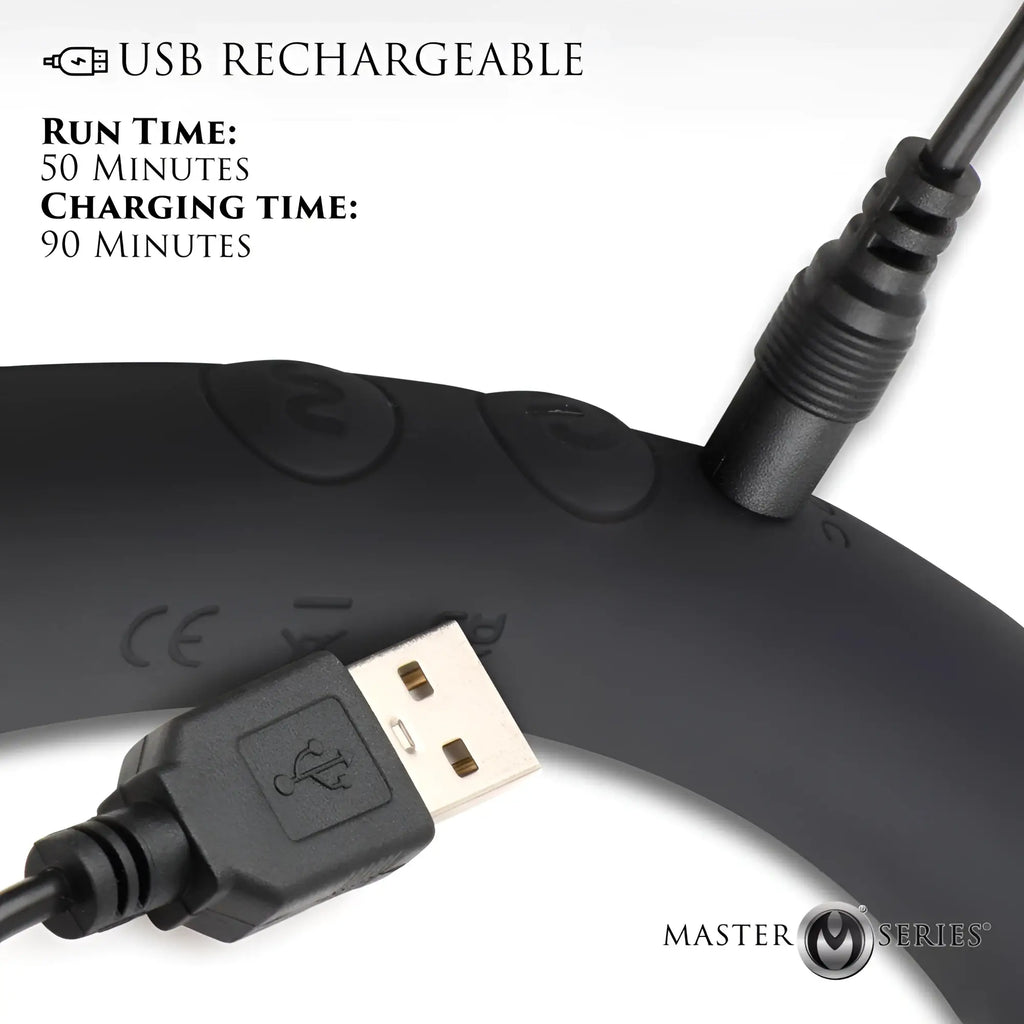 Master Series 10X Vibra-Crescent black silicone dildo being charged with a USB cable. Text shows 50-minute run time.