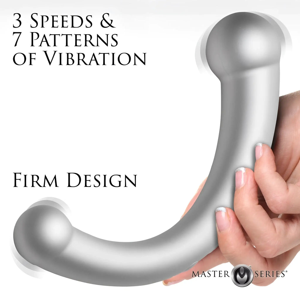 Master Series 10X Vibra-Crescent: a silver, crescent-shaped, dual-ended silicone vibrating dildo held in a hand.