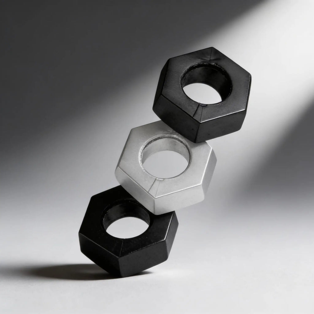 Master Series 3pc Kit: two black and one silver hexagonal, nut-shaped ball stretchers stacked against a grey backdrop.