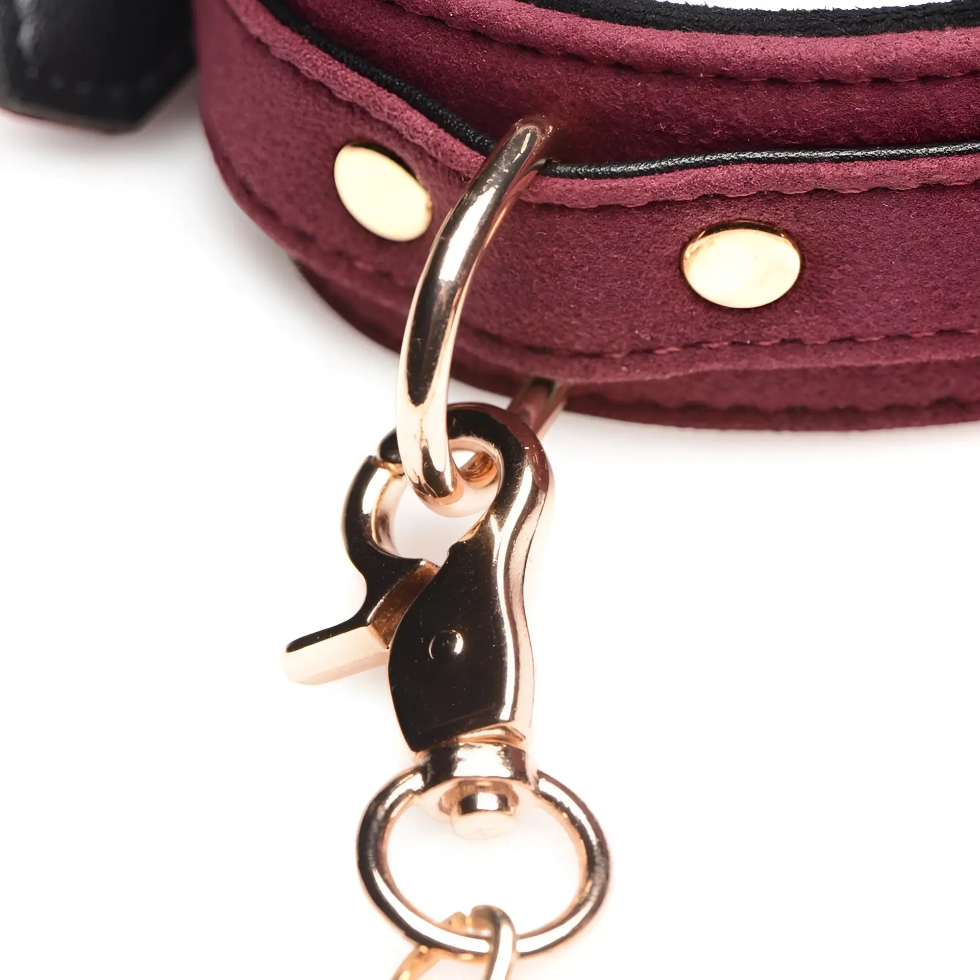 Master Series 6 Piece Velvet Bondage Set: Close-up of a burgundy velvet cuff with gold-tone hardware and metal snap.
