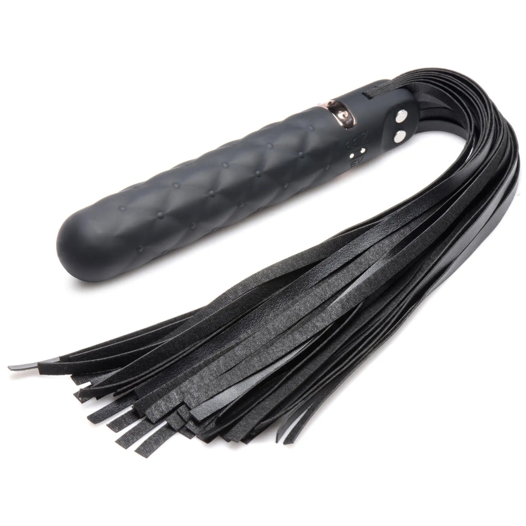 Master Series 9X black silicone vibrating flogger with a quilted handle and multiple leather-like streamers.