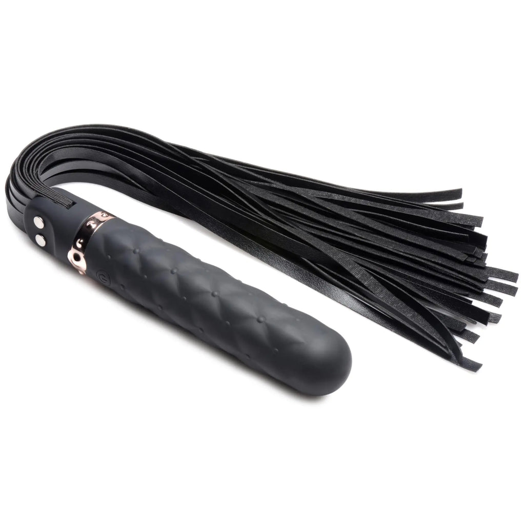 Master Series 9X black silicone vibrating dildo flogger with a textured handle, rose gold accents, and leather strips.