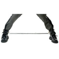 Master Series Adjustable Steel Spreader Bar connecting the ankles of a person wearing black leather pants and boots.