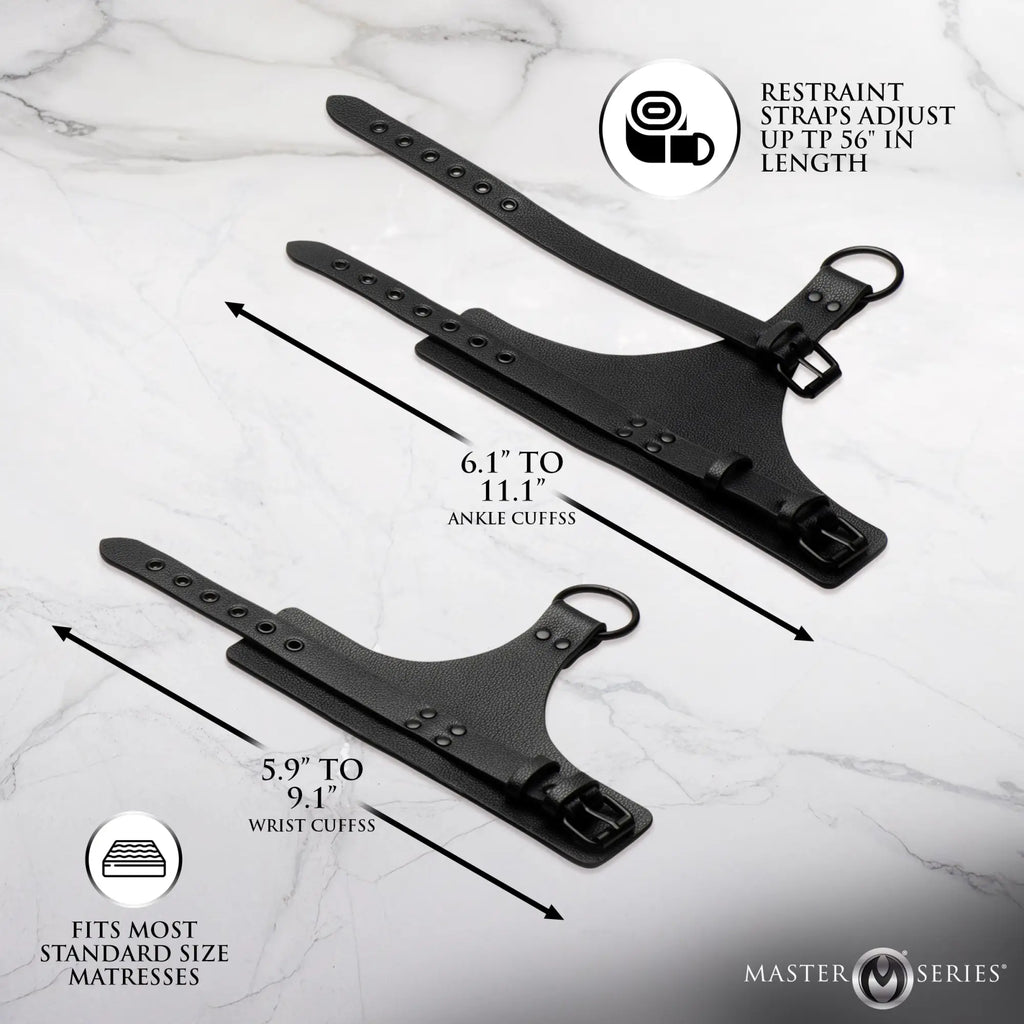 Master Series All Access Bed Restraint Kit with black adjustable leather ankle and wrist cuffs on marble background.