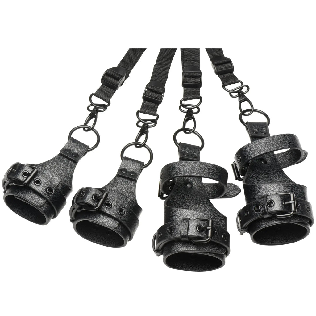 Master Series All Access Bed Restraint Kit: Four black, textured faux-leather wrist and ankle cuffs with buckles.