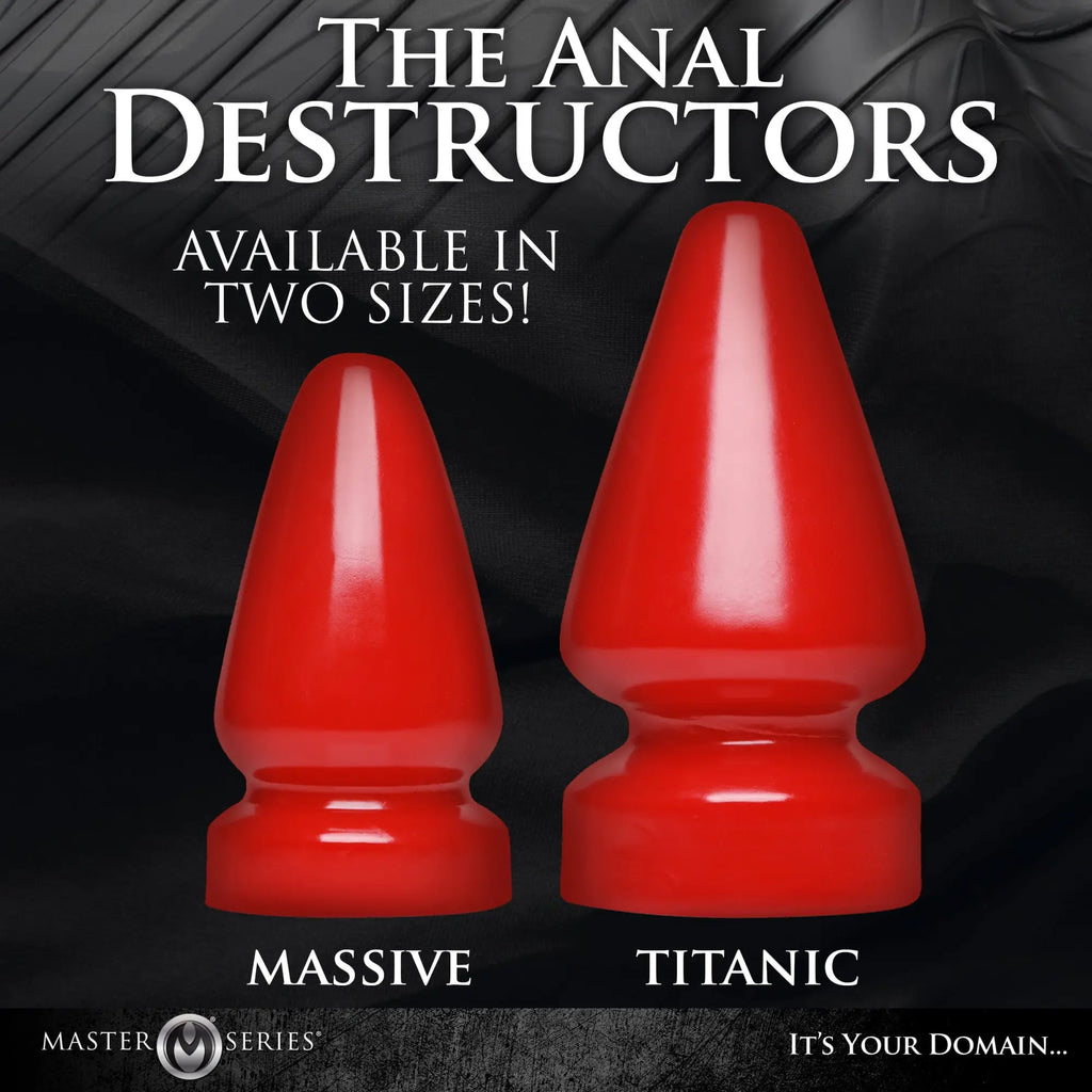 Two glossy red Master Series Anal Destructor butt plugs, labeled Massive and Titanic, stand against a black background.
