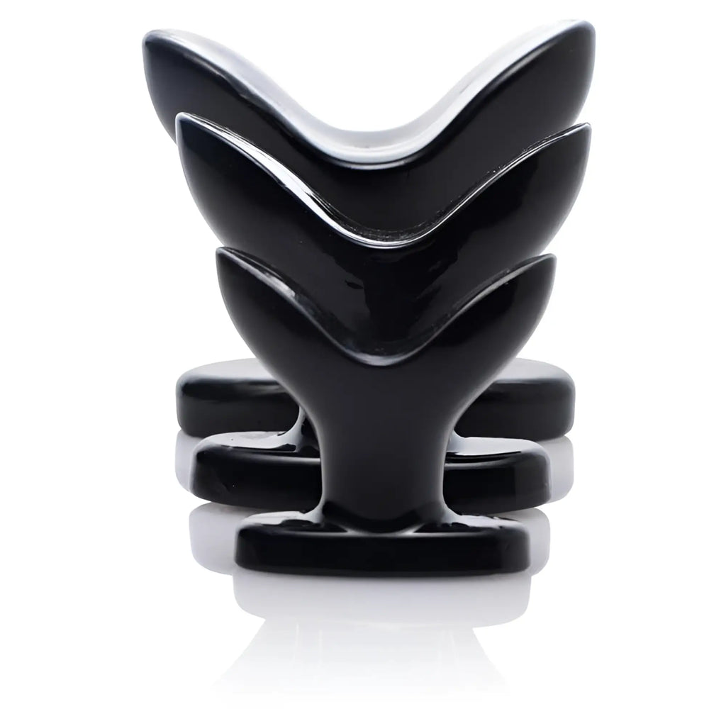 Three shiny black Master Series Ass Anchor butt plugs arranged in a row, featuring a flared, V-shaped anchor design.