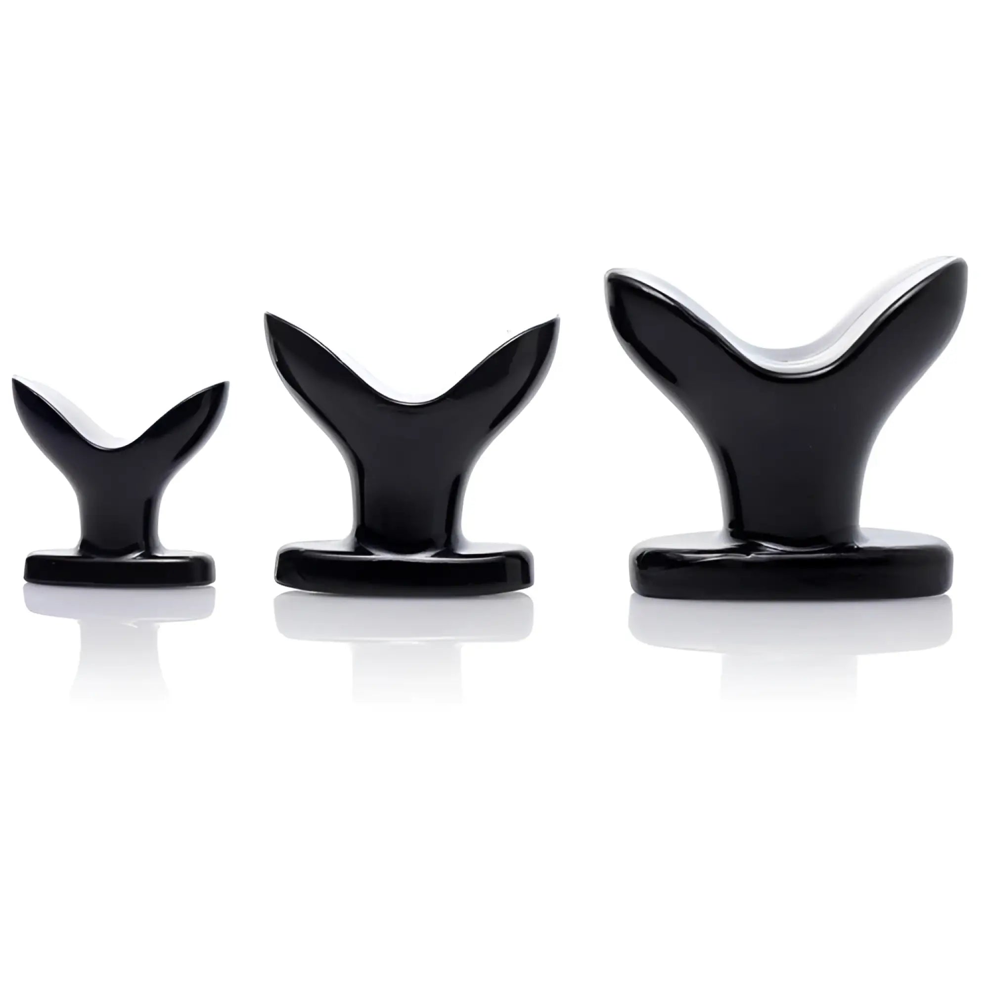 Three Master Series black, anchor-shaped butt plugs of graduated sizes standing in a row against a white background.