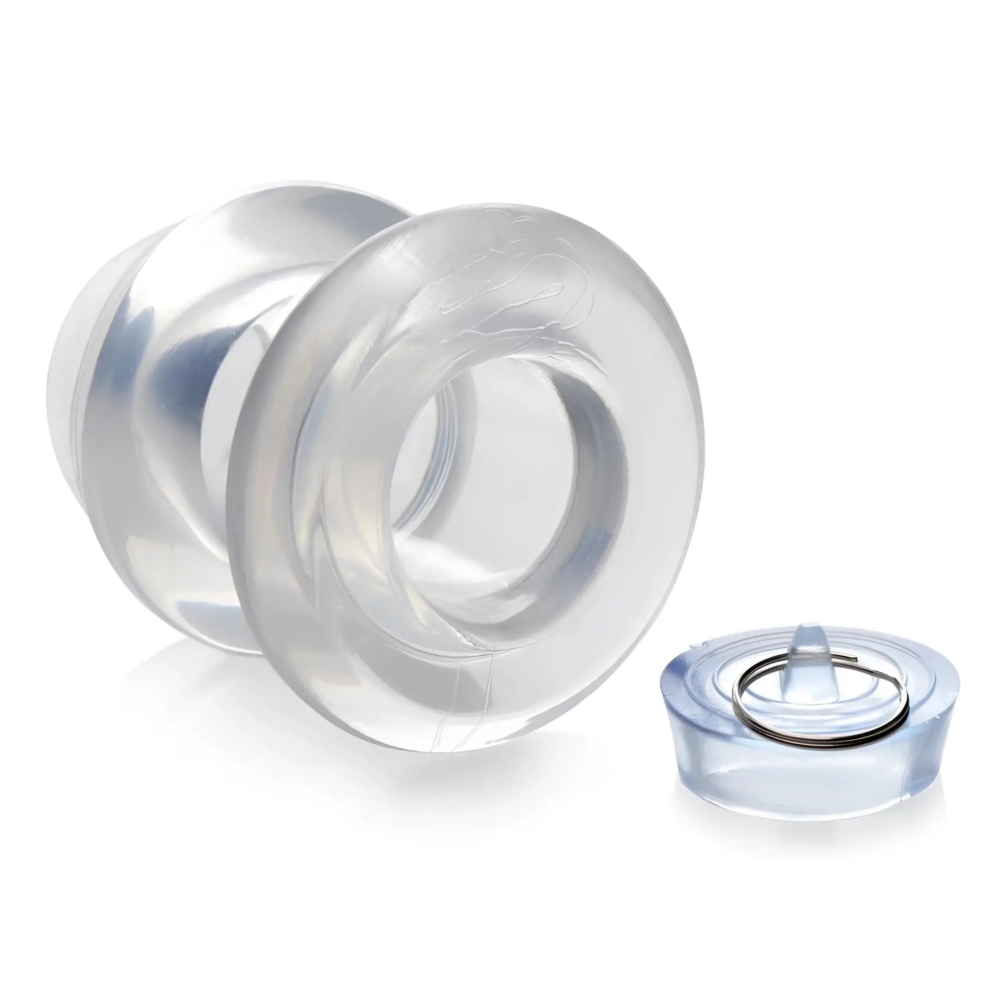 Clear Master Series Ass Bung hollow anal dilator with a removable matching plug and metal ring, isolated on white.