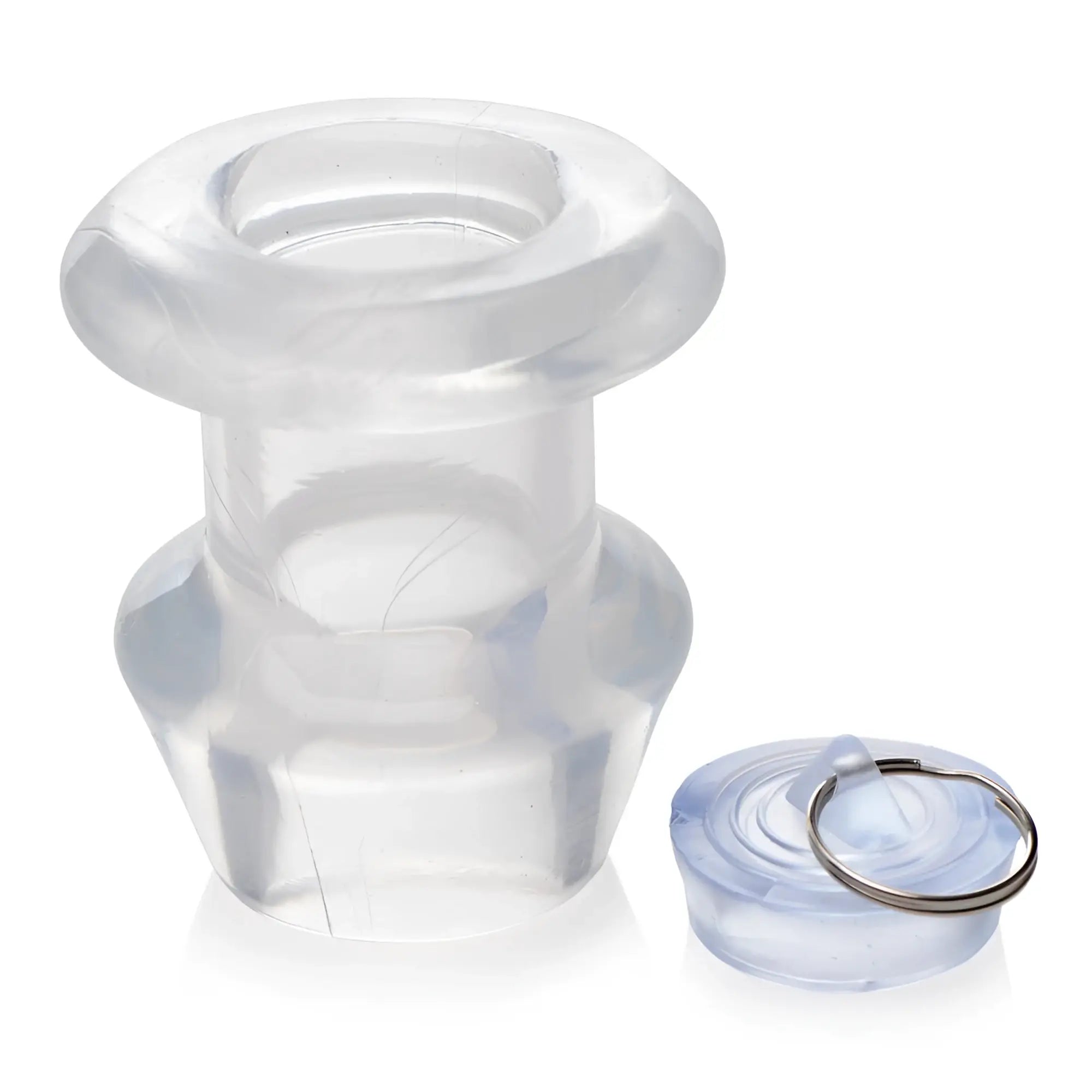Master Series clear, hollow silicone anal dilator with a removable plug, set against a white background.