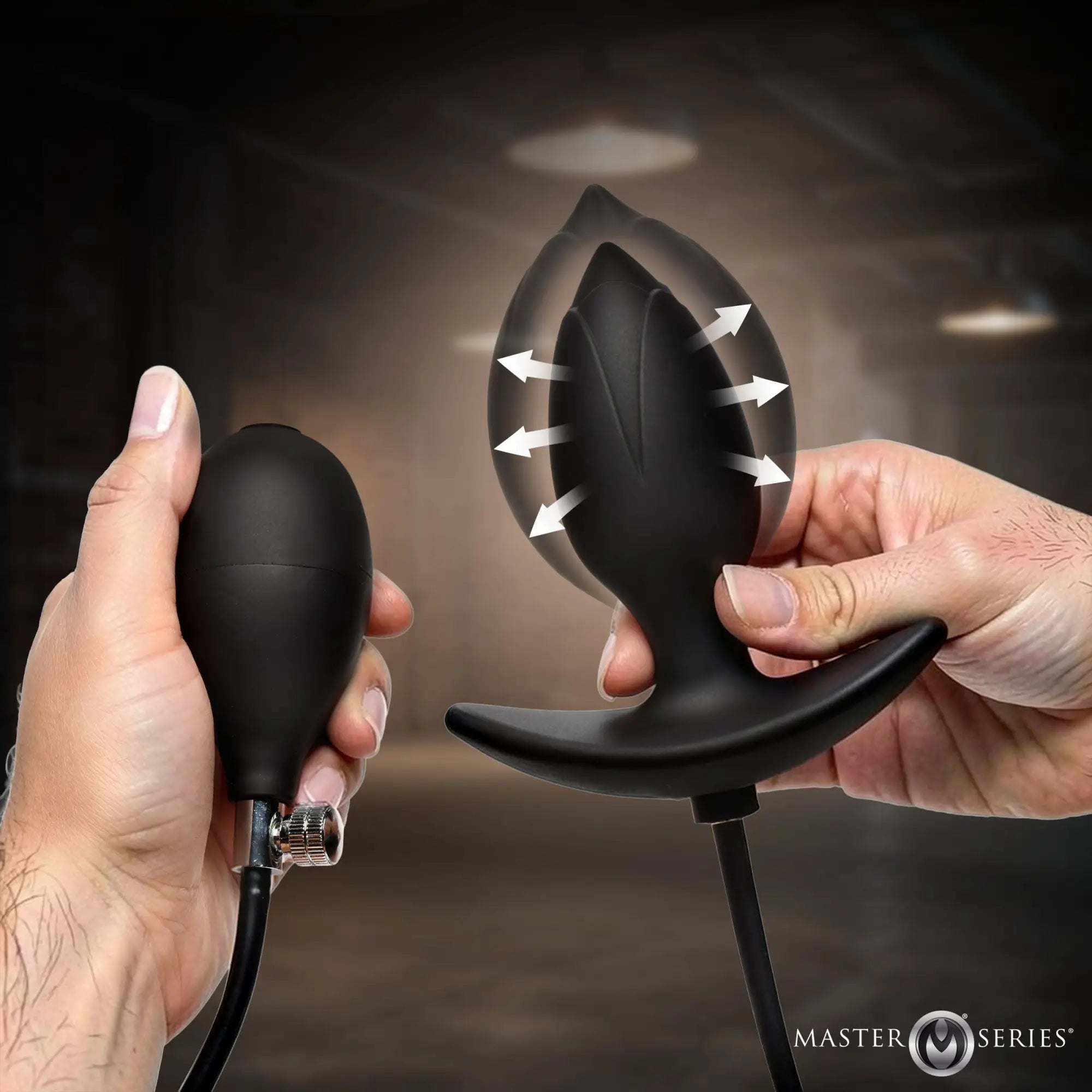 Master Series Ass Expander: A black, inflatable silicone anal plug with hand pump, shown expanding with directional arrows.