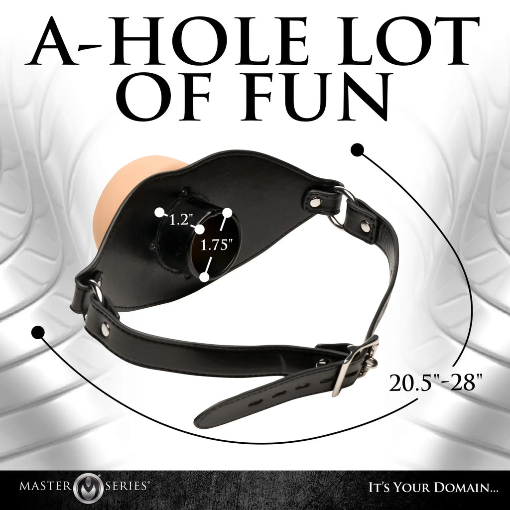 Master Series Ass Face oral gag with black leather strap, flesh-toned insert, and measurement labels on white background.