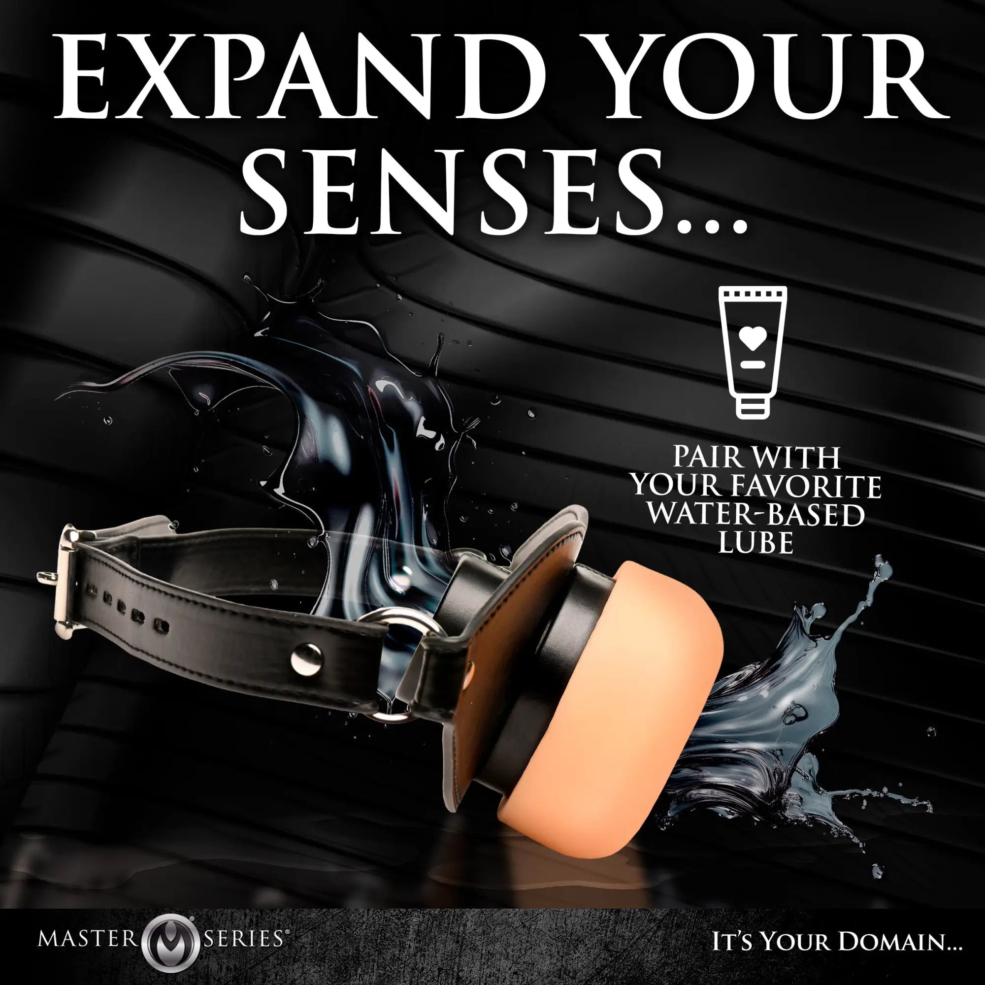Master Series mouth gag with black leather strap and beige silicone mouth-piece, depicted with liquid splash effects.