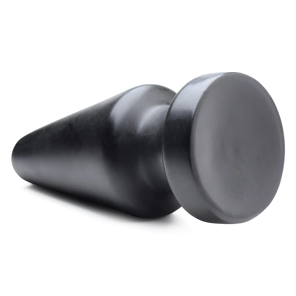 Master Series Ass Max large black anal plug, featuring a smooth, tapered cone shape and a flat, circular base.