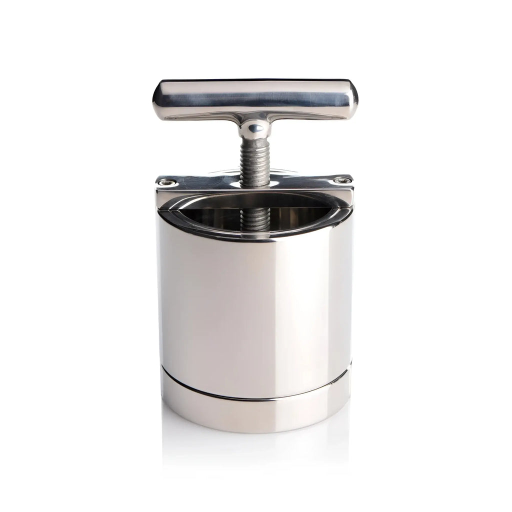 Master Series The Ball Press Chamber: A polished, stainless steel cylinder press with a T-handle screw mechanism.