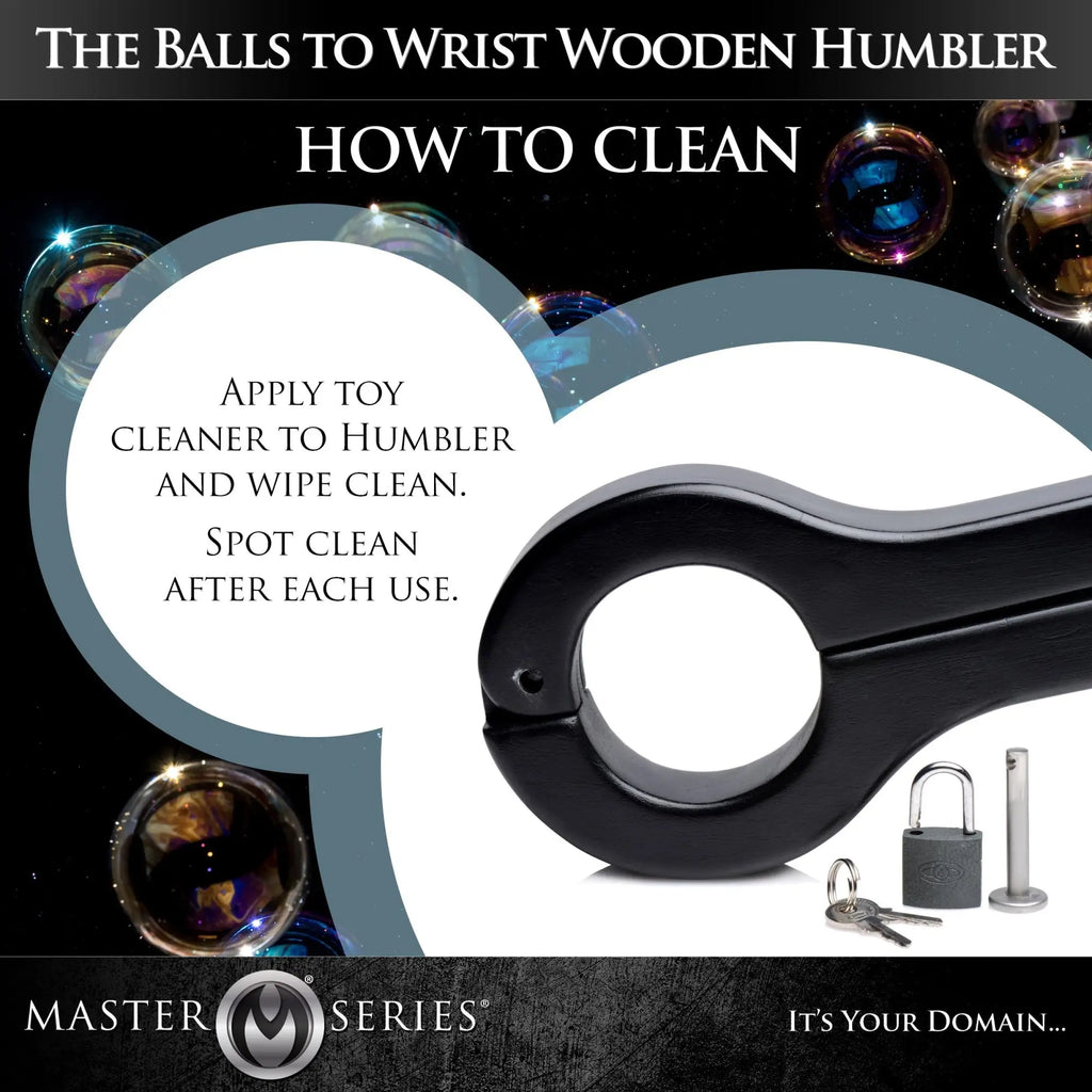 Master Series black wooden balls to wrist humbler with a padlock, keys, and cleaning instructions on a bubbly background.