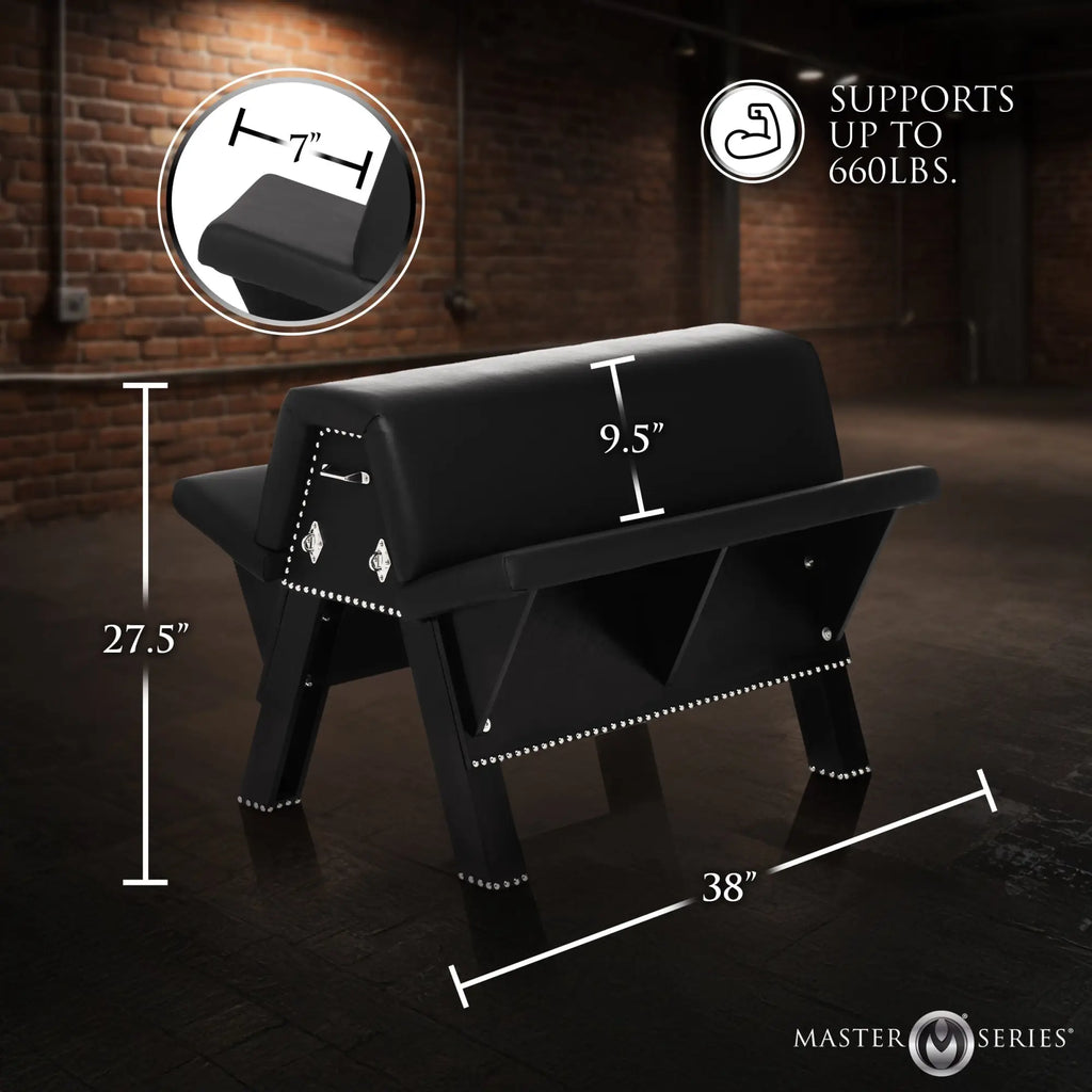 Master Series Bareback Submission Horse: Black padded leather bench with silver studs and dimensions on a brick background.