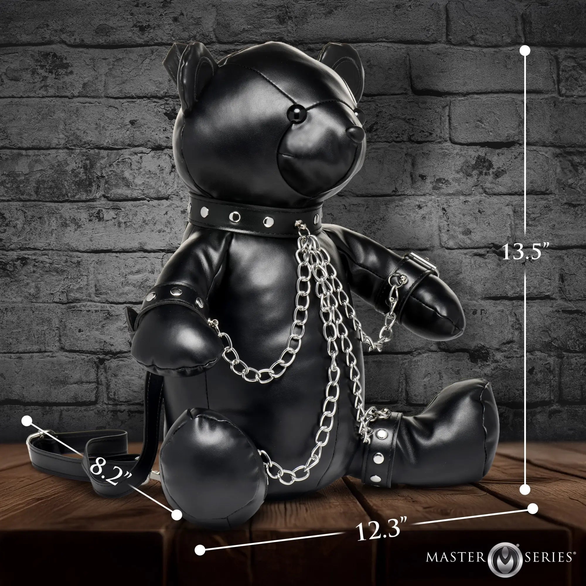 Black Master Series BDSM teddy bear backpack featuring leather construction, silver chain hardware, and metal studs.