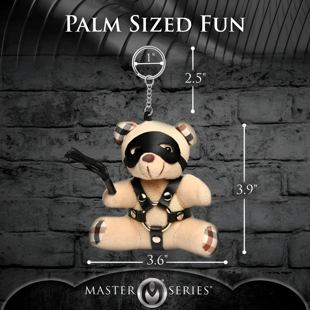 Master Series BDSM teddy bear keychain featuring a tan plush bear, black leather mask, harness, and miniature crop.