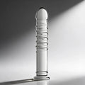 Master Series Behemoth XL dildo, a clear glass toy featuring a rounded tip, spiraled ribs, and a flared base.