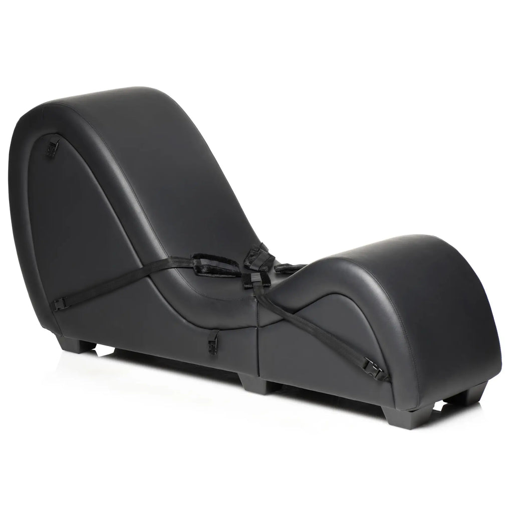 Master Series black detachable kinky couch chaise with an ergonomic curved design and integrated black restraint straps.