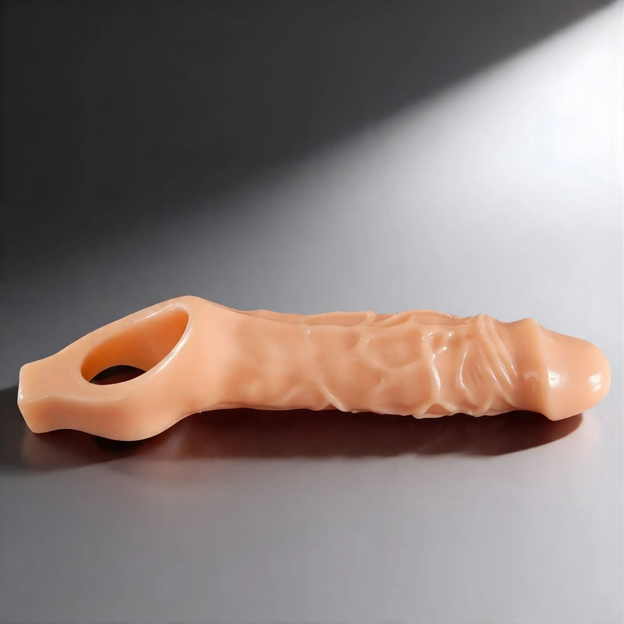 Master Series Black Mamba cock sheath in tan, featuring a realistic textured, veined design with a base ring.