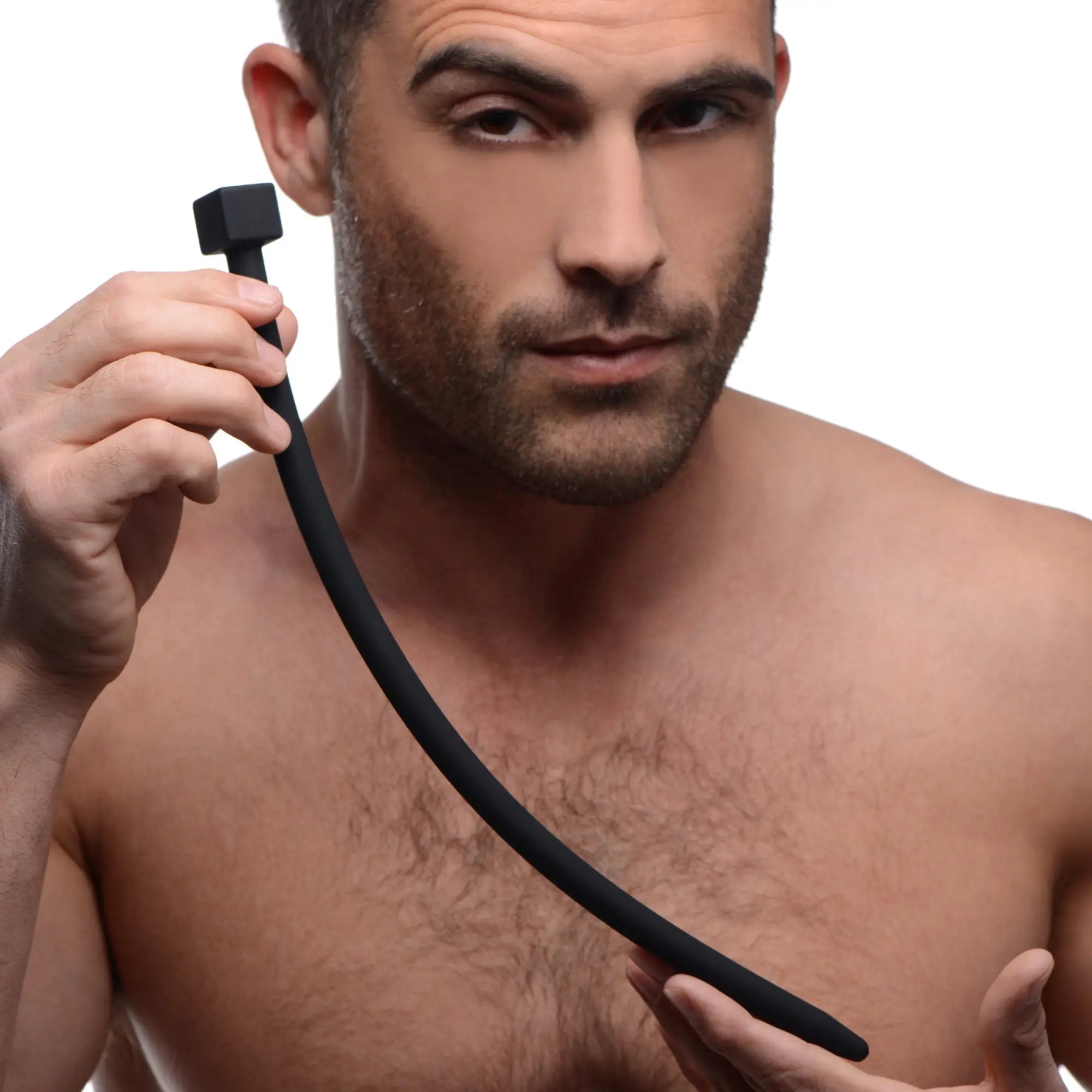 A man holds a smooth, black Master Series Bolted Deluxe silicone urethral sound with a square-shaped handle.