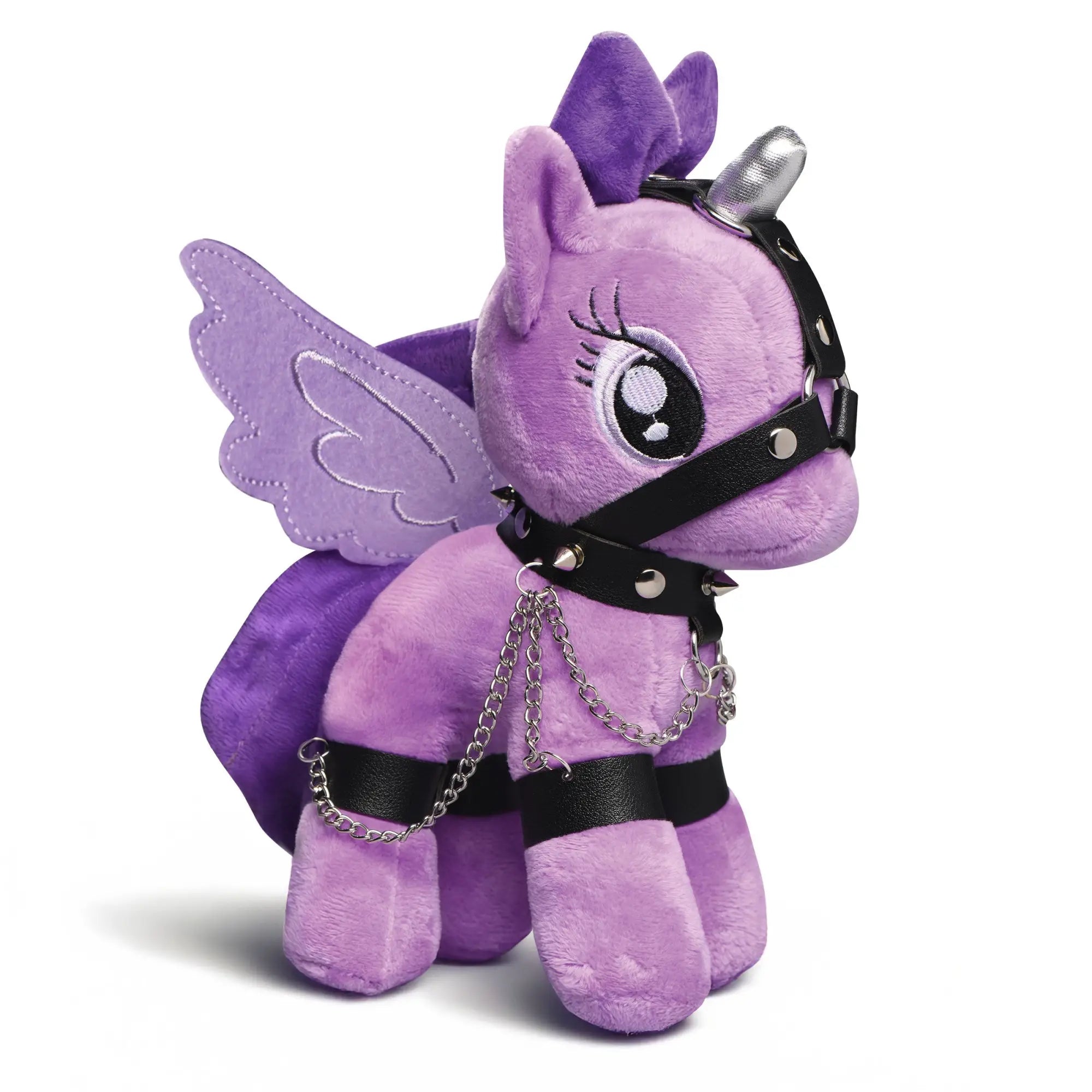 Master Series Bondage Pony: A purple plush unicorn with wings, wearing a black spiked collar, harness, and leg chains.