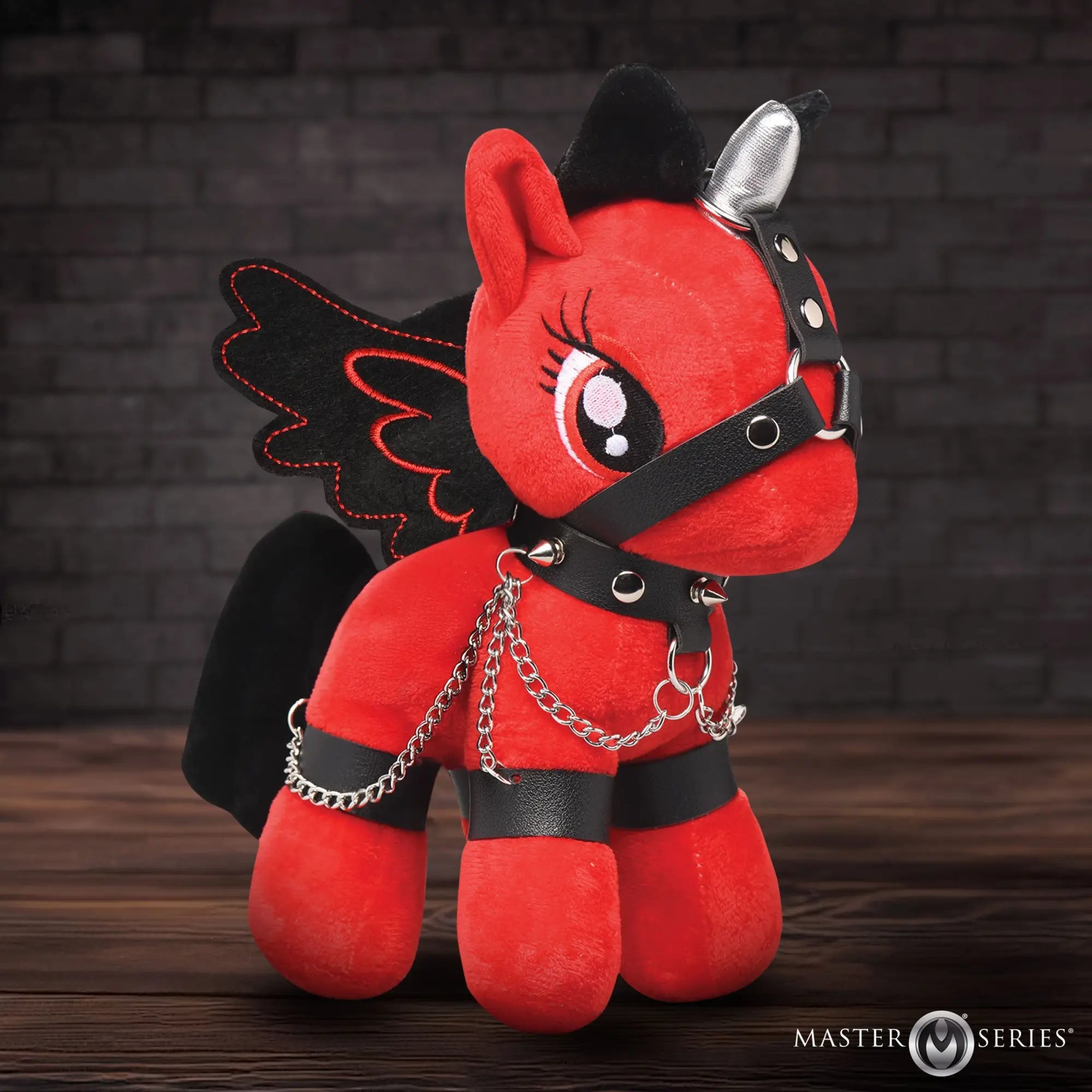 Master Series Bondage Pony: A plush red unicorn with black wings, wearing a leather harness and silver chains.