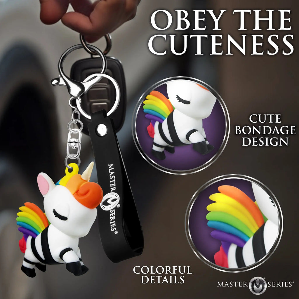 Master Series Bondage Unicorn keychain with white, rainbow-maned unicorn figure featuring black straps and a black strap.