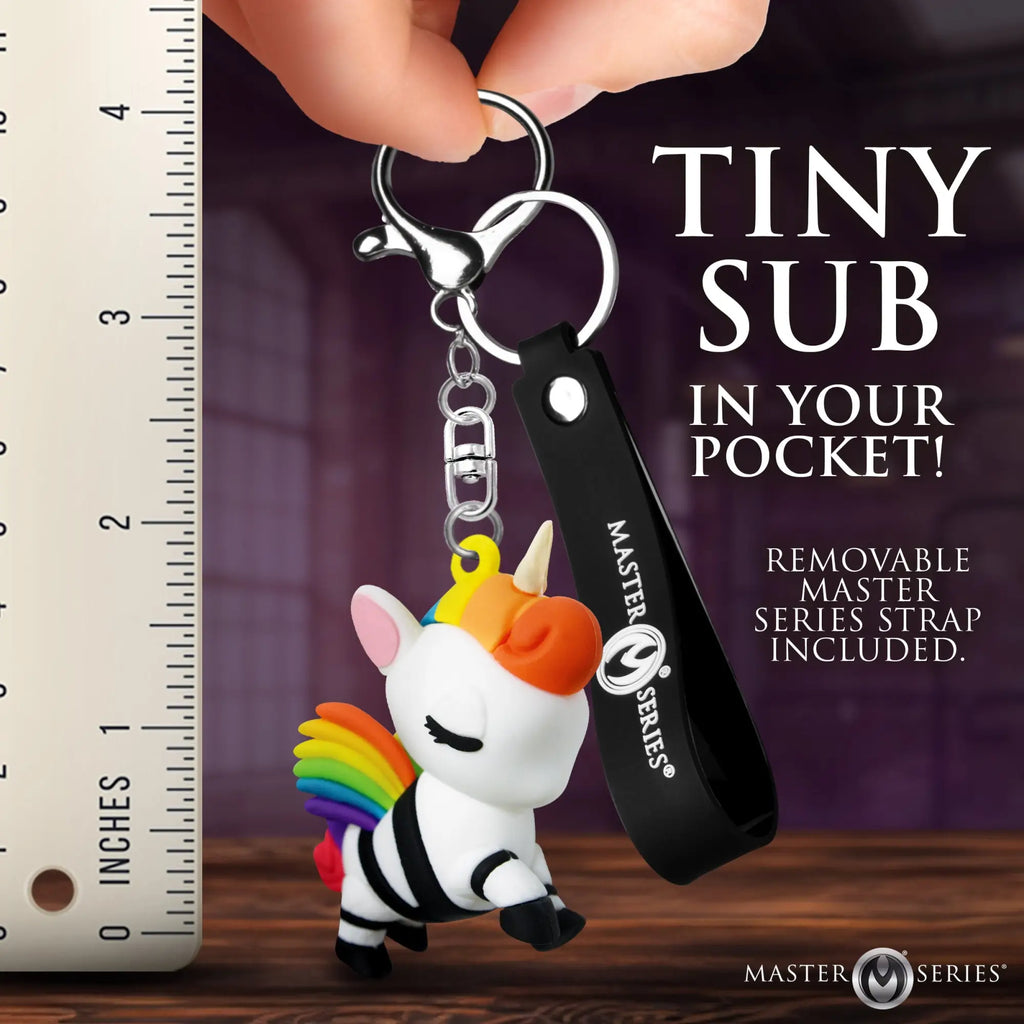 Master Series Bondage Unicorn keychain: a white unicorn with rainbow hair, black restraints, and a black logo strap.