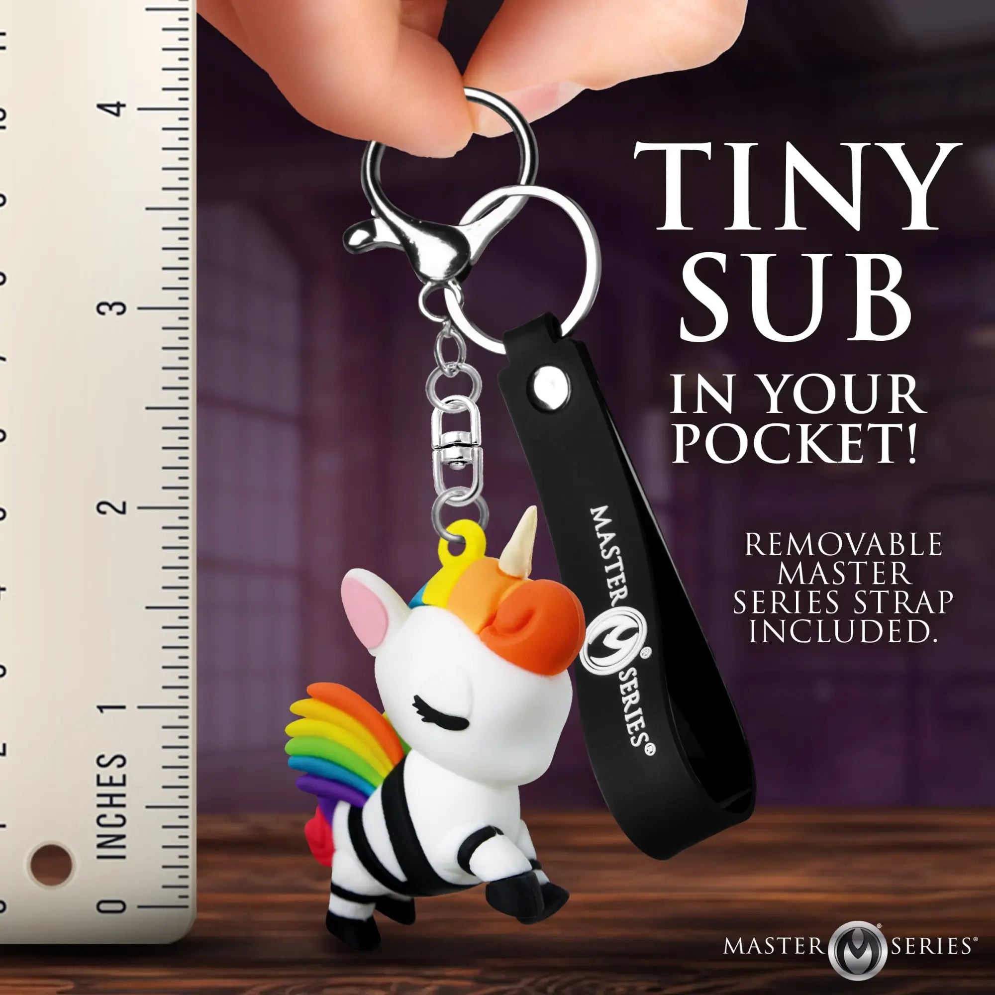 Master Series Bondage Unicorn keychain: a white unicorn with rainbow hair, black restraints, and a black logo strap.