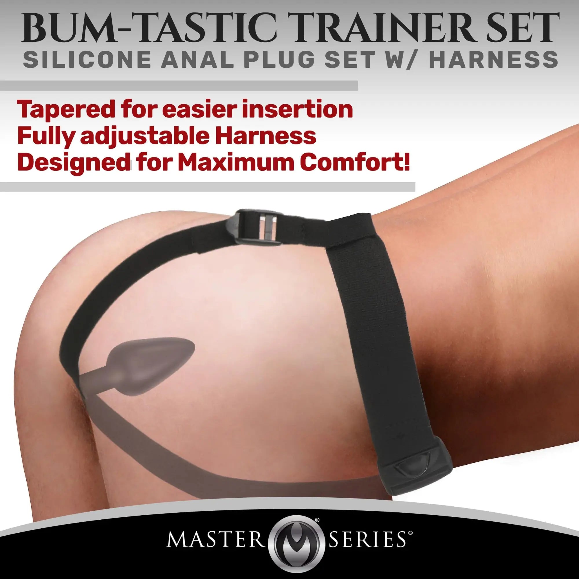 Master Series Bum-Tastic Trainer Set: Black silicone anal plug with an adjustable black harness worn on the body.