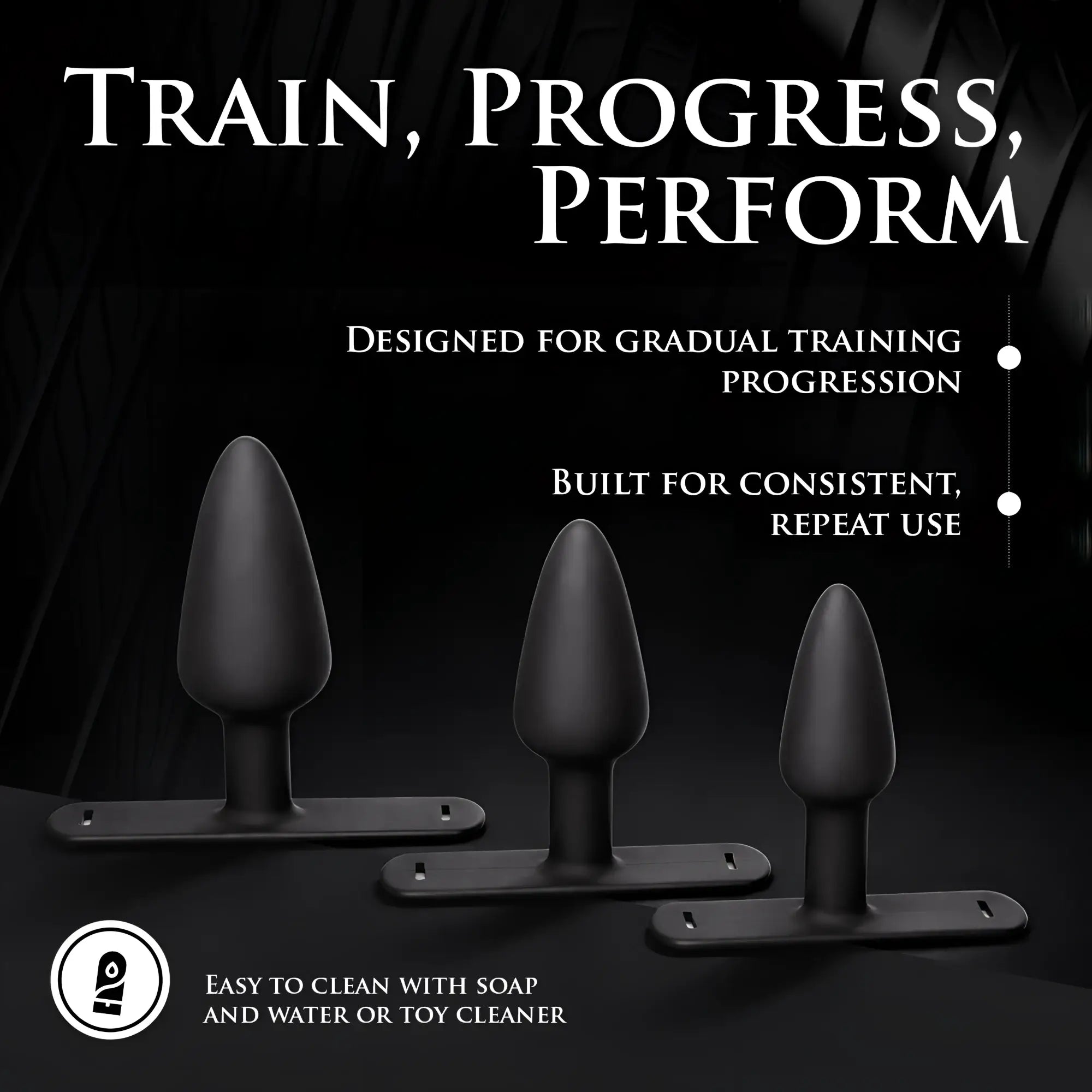 Master Series Bum-Tastic Trainer Set: three smooth, black silicone anal plugs with harness-compatible flat bases.