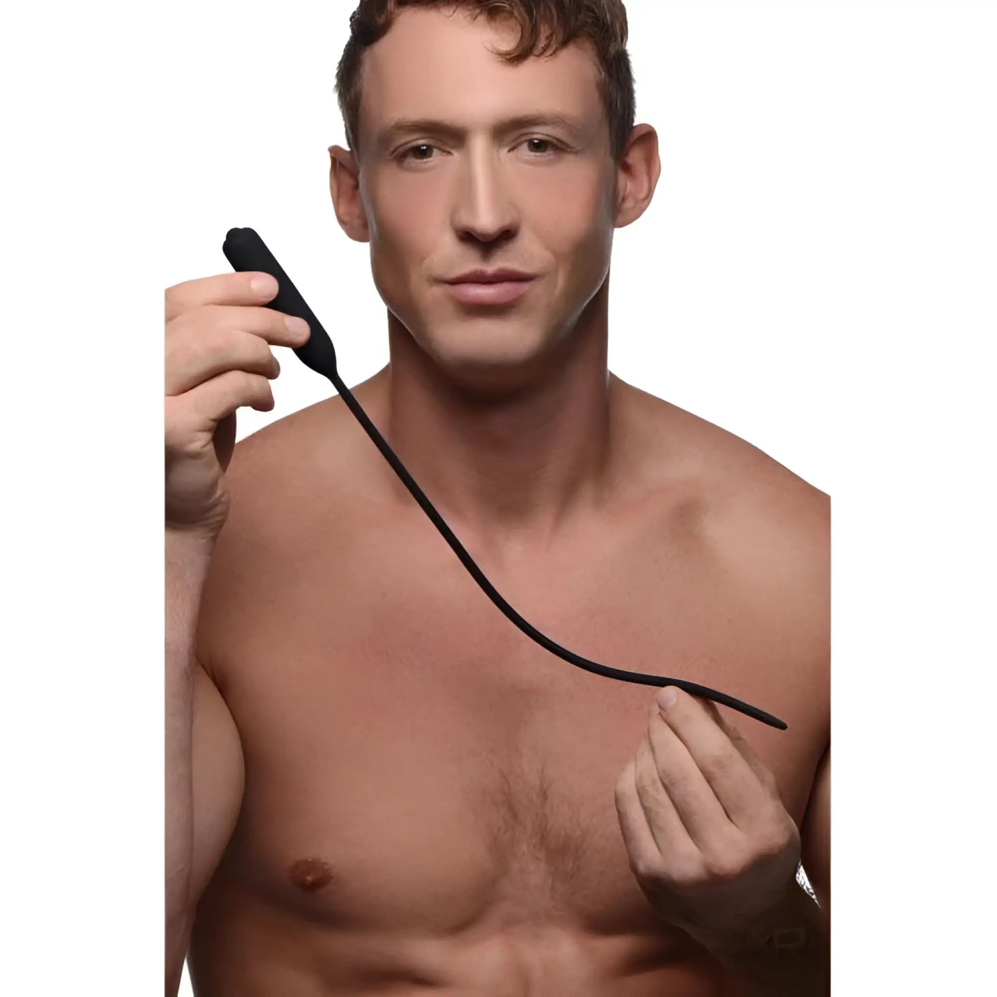 A shirtless man holding a long, thin, black Master Series Cadence Extreme 10x Vibrating Urethral Sound.