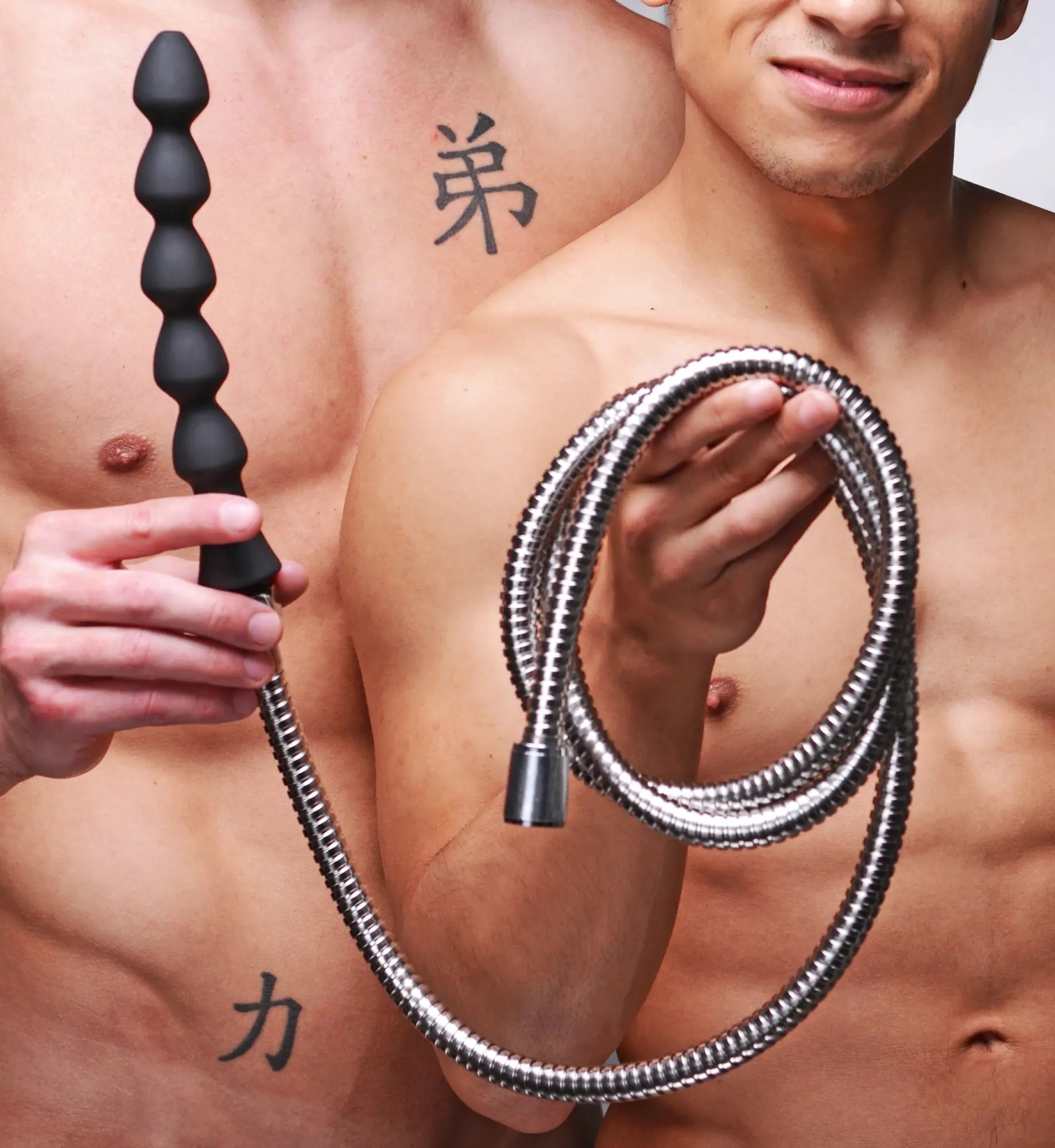 Master Series Canal Silicone Enema Attachment: a black, multi-beaded silicone wand with a long, flexible silver hose.