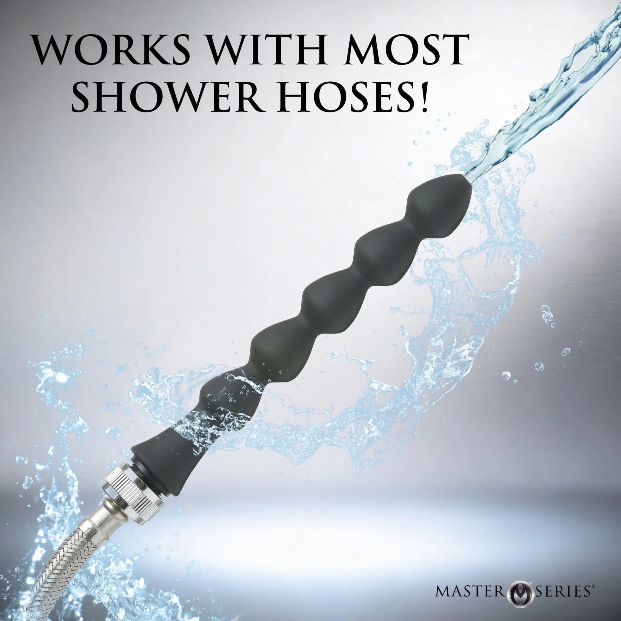 Master Series Canal silicone enema attachment: a black, multi-bead wand connected to a metal shower hose spraying water.