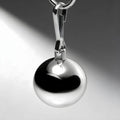 Master Series 8oz chrome ball weight hanging from a metal clip against a gradient gray background.