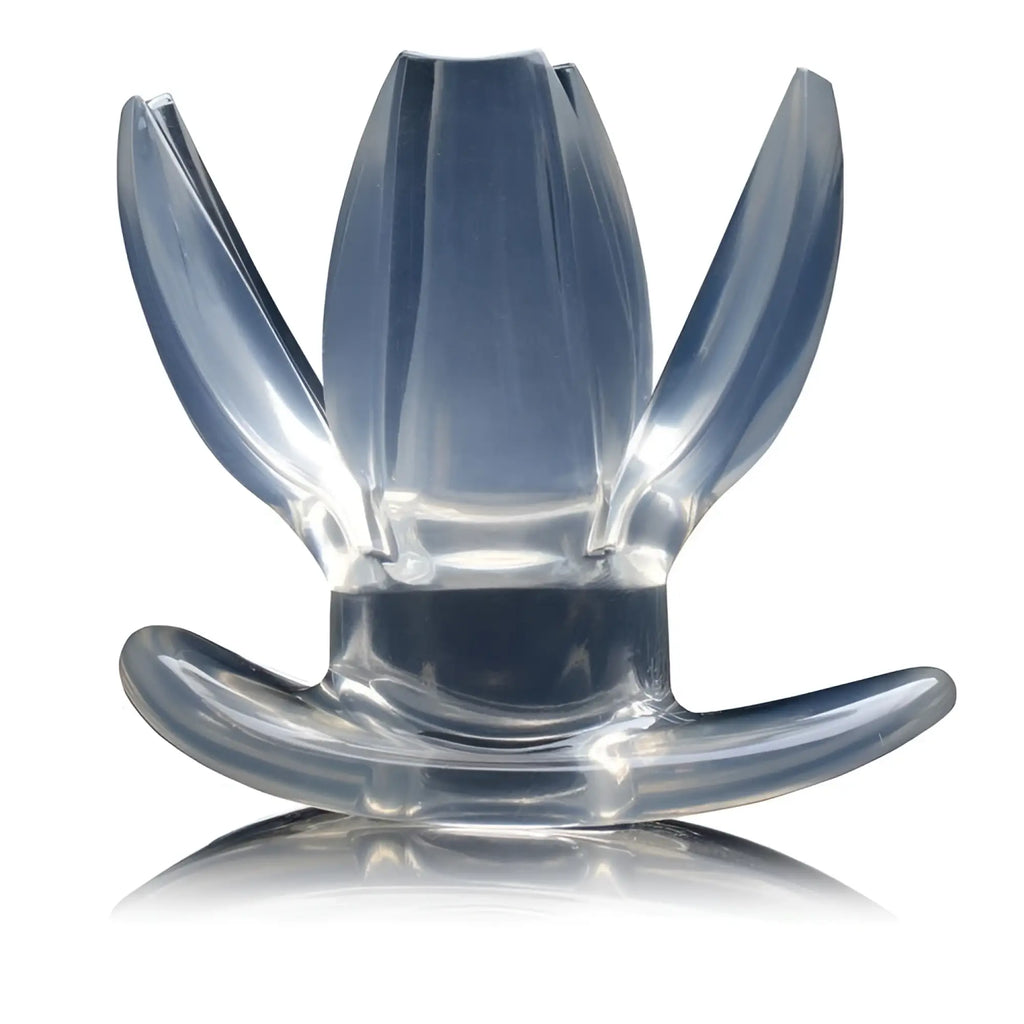 Master Series Clawed Expanding Clear Dilator: a transparent, petal-shaped expanding device on a curved base.