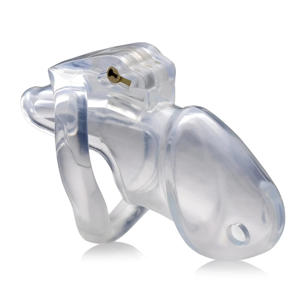 Master Series Clear Captor: A transparent, curved acrylic chastity cage with a small brass lock mechanism.