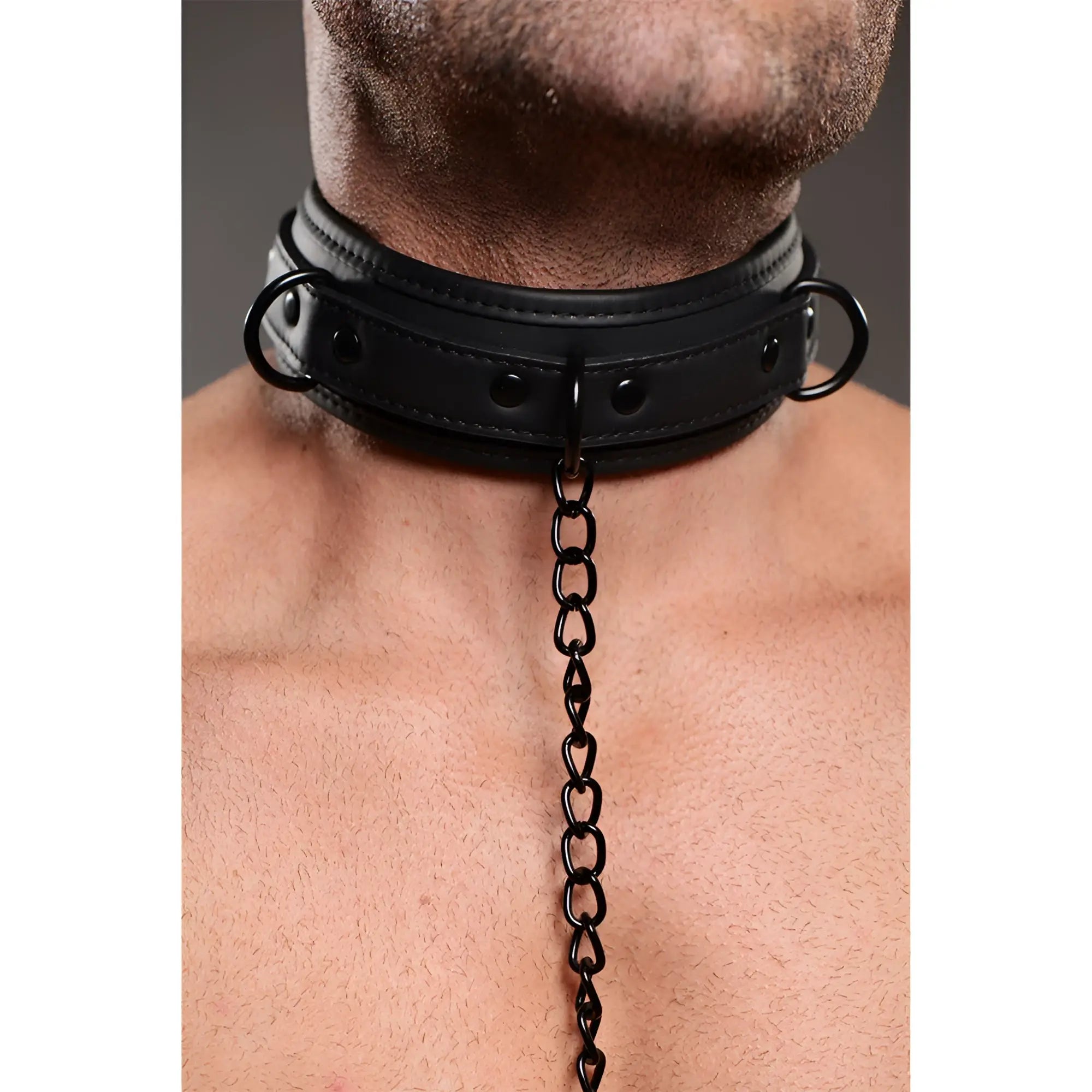 Master Series black leather-style collar with metal hardware and center chain worn on a person's neck.